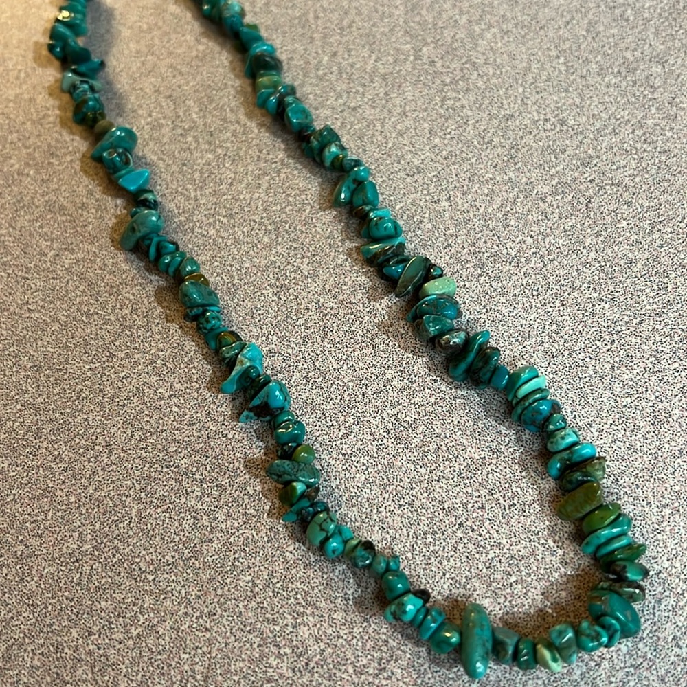 Turquoise necklace with silver clasp, 17 inches long.